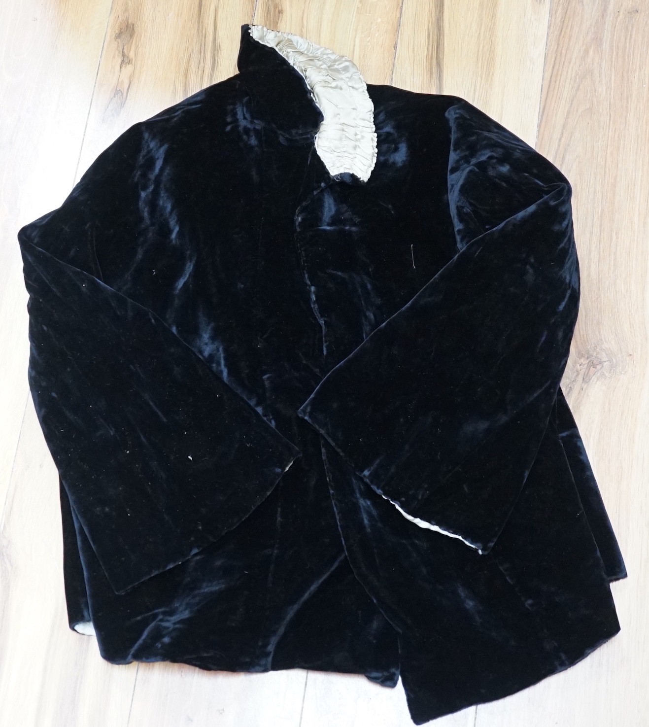 QA 1920's velvet jacket, a 1940's crepe evening dress, an embroidered shawl, two dresses, etc.